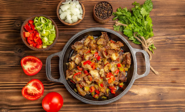 A colorful chicken stir-fry with vegetables served over rice.