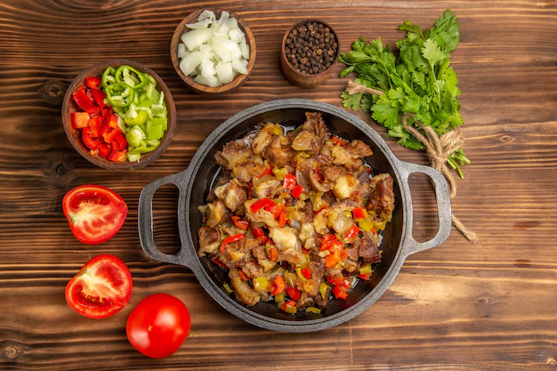 A colorful chicken stir-fry with vegetables served over rice.