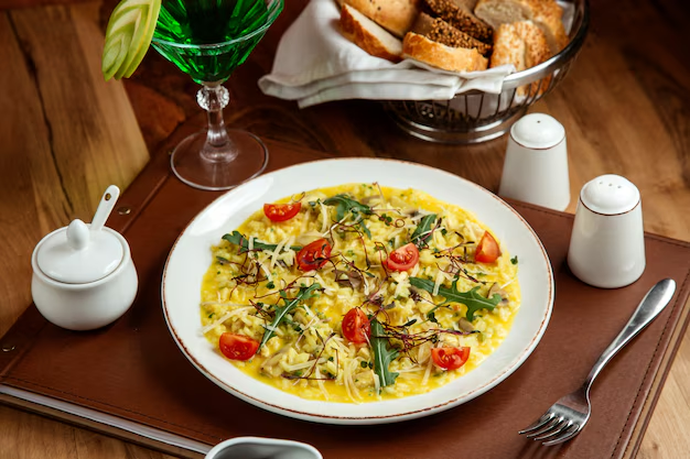 Spinach and mushroom frittata served on a plate with a side salad.